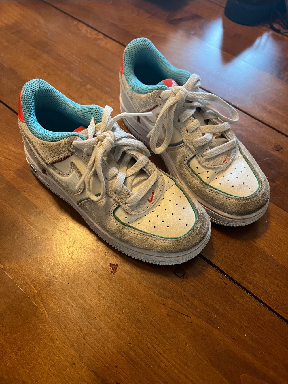 Nike Kids White Sneakers with Teal and Orange Accents